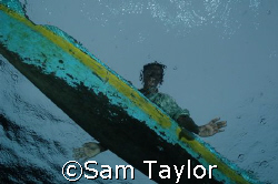 Ascending amidst the canoes, always the canoes.... Kimbe ... by Sam Taylor 